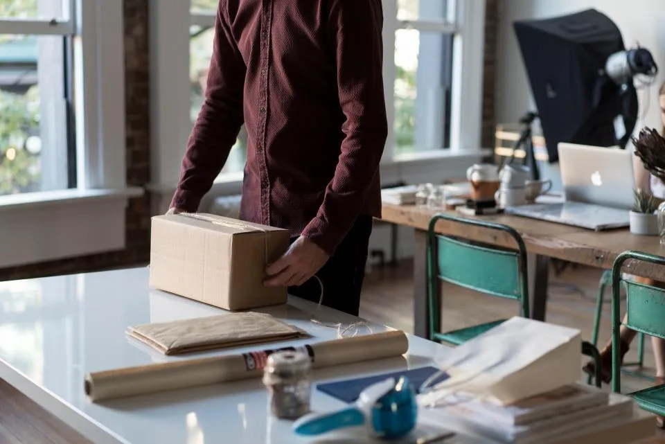 A parcel being packed on a work table